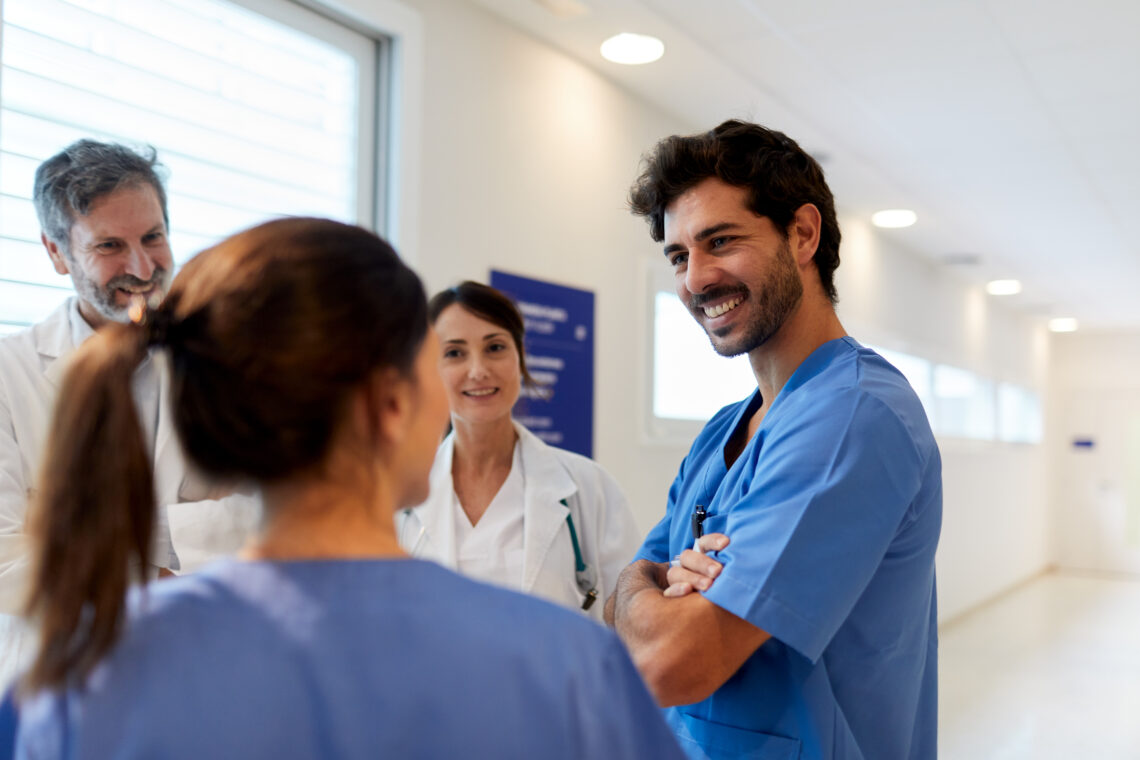 Hospital Health Care Workers In An Informal Meeting.