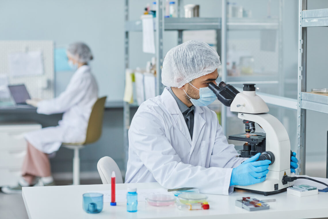 Scientist Working With Sample Of Virus In The Lab